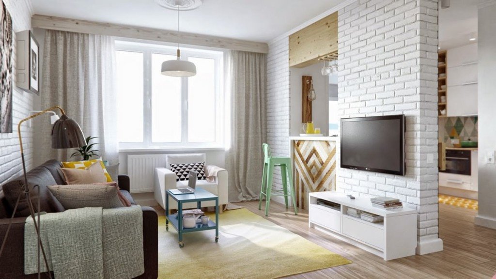 A brick wall separates the seating area from the kitchen