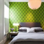 Green wall above the bed