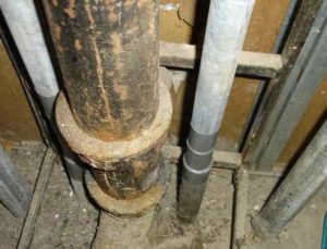 Replacing a cast-iron sewer riser with a plastic one