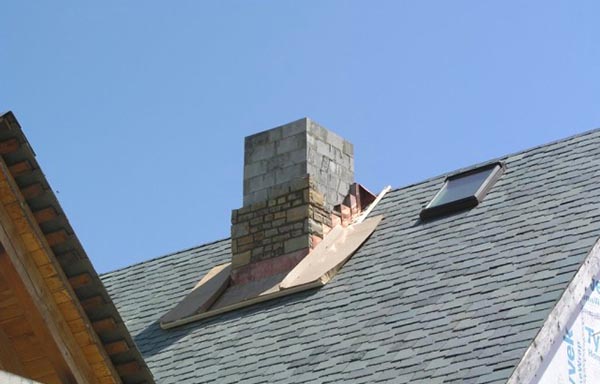 Chimney passing through a wooden ceiling