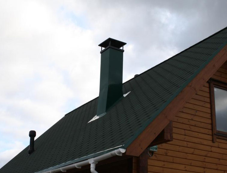 Chimney passing through a wooden ceiling